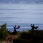 Dongyue Zhuang and Hong Li do tai chi fan at Harborview Park on Tuesday, April 6, 2021 in Everett, Wa. (Olivia Vanni / The Herald)