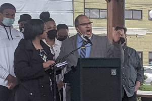 JJ Frank, alongside his wife Patrice Frank, speaks out against racist death threats at Comeford Park in Marysville on April 3, 2021. (Zachariah Bryan / The Herald)