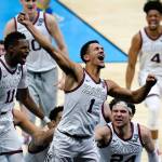 Gonzaga guard Jalen Suggs (1) celebrates after making the game-winning basket against UCLA during overtime on Saturday in Indianapolis. Gonzaga won 93-90. (AP Photo/Michael Conroy)