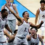 Gonzaga guard Jalen Suggs (1) celebrates making the game winning basket against UCLA during overtime in a men's Final Four NCAA college basketball tournament semifinal game, Saturday, April 3, 2021, at Lucas Oil Stadium in Indianapolis. Gonzaga won 93-90. (AP Photo/Michael Conroy)