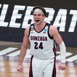 Gonzaga forward Corey Kispert (24) celebrates during the second half of an Elite 8 game against Southern California in the NCAA men's college basketball tournament at Lucas Oil Stadium, Tuesday, March 30, 2021, in Indianapolis. (AP Photo/Michael Conroy)