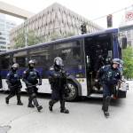 Washington State Patrol troopers walk off of a bus in front of Seattle City Hall as they prepare for demonstrators to arrive on June 3, 2020, in Seattle. (AP Photo/Elaine Thompson, file)