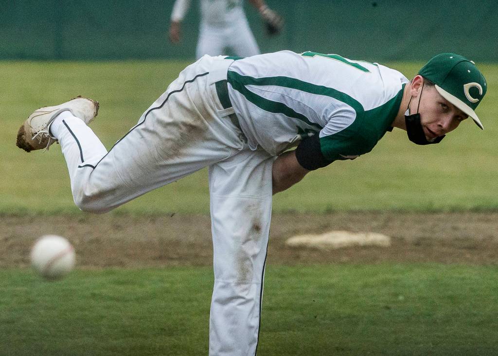 Marysville Getchells Bradley Johnson pitches the ball during a game against Marysville Pilchuck on April 7, 2021, in Marysville. (Olivia Vanni / The Herald)