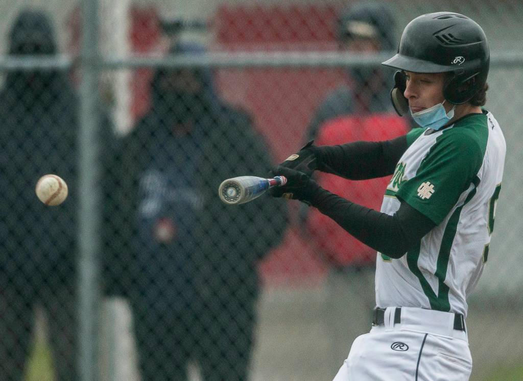 Marysville Getchells Cannon Van Dalen hits the ball during a game against Marysville Pilchuck on April 7, 2021, in Marysville. (Olivia Vanni / The Herald)