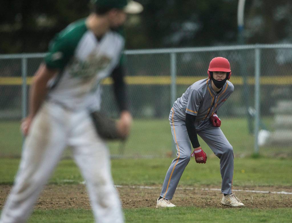 Marysville Pilchucks Royce Hale watches Marysville Getchell pitcher Bradley Johnson during a game on April 7, 2021, in Marysville. (Olivia Vanni / The Herald)