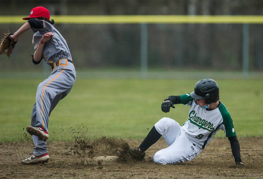 Marysville Getchells Cannon Van Dalen slides into second base during a game against Marysville Pilchuck on April 7, 2021, in Marysville. (Olivia Vanni / The Herald)
