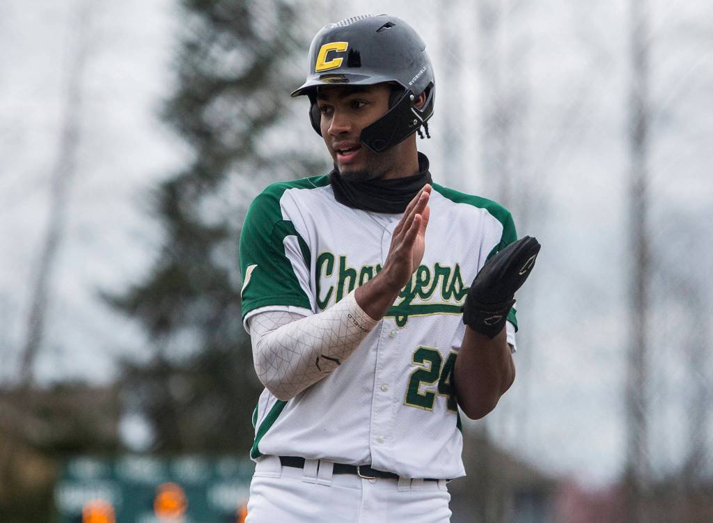 Marysville Getchell Malakhi Knight claps after making it to third base during a game against Marysville Pilchuck on April 7, 2021, in Marysville. (Olivia Vanni / The Herald)