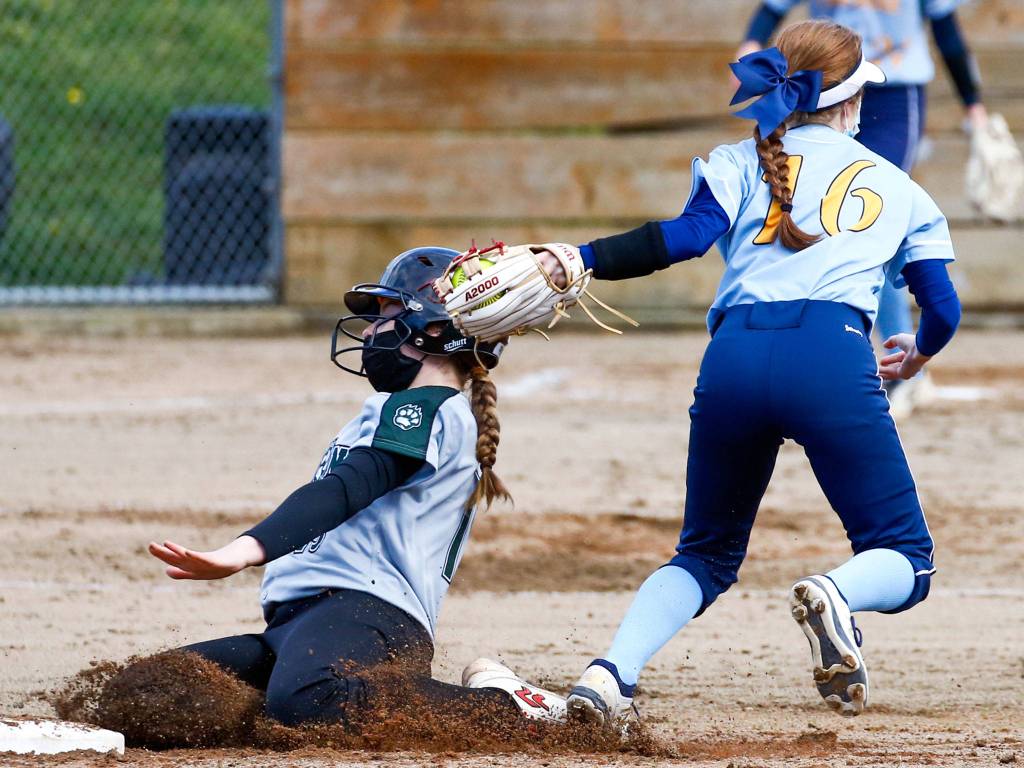 Everetts Isabel Koivu lays down a tag on a Jackson player during a game on April 8, 2021, at Henry M. Jackson High School in Mill Creek. (Kevin Clark / The Herald)