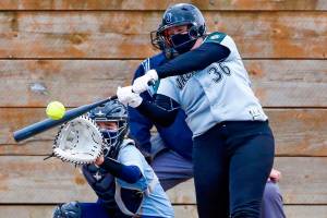 Jackson's Amanda Wingert connects with a pitch during a game against Everett on Thursday afternoon at Henry M. Jackson High School in Mill Creek on April 8, 2021. The Timberwolves won 14-0. (Kevin Clark / The Herald)