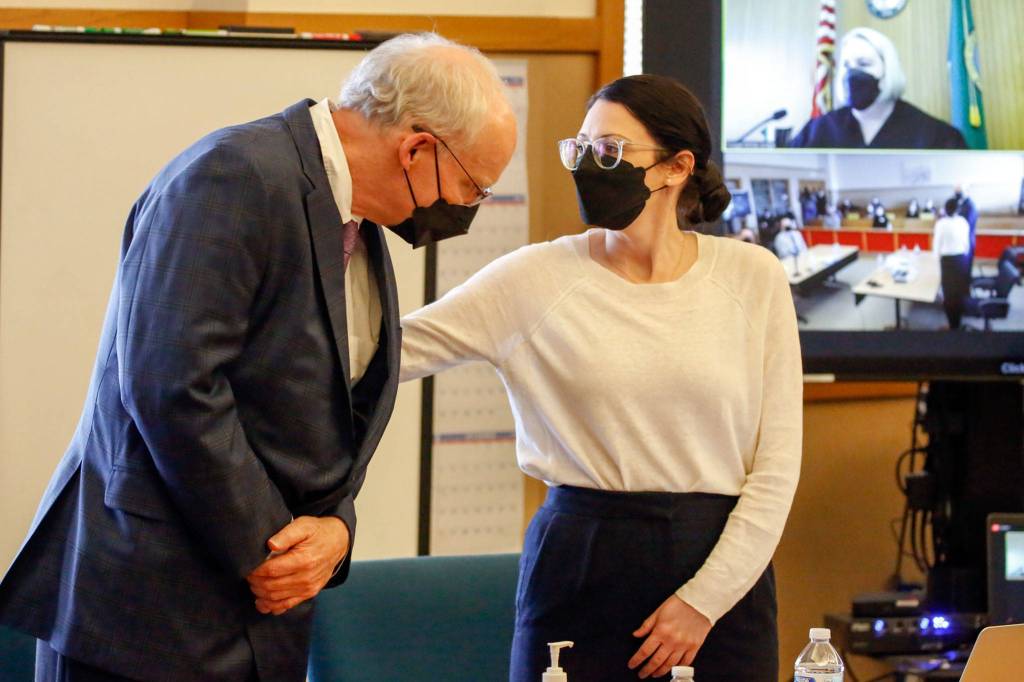 Simeon Berkley (left), who was found guilty of second-degree murder, with defense attorney Laura Shaver at the Snohomish County Courthouse in Everett on Thursday. (Kevin Clark / The Herald)