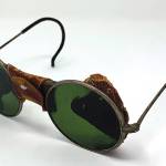 This is a very early pair of glasses with tinted lenses not used as sunglasses. (Cowles Syndicate Inc.)