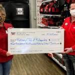 Beth Kealy, President of the Rotary Club of Edmonds accepts a check from Chris Kyser, store director of Edmonds Hero Ace Hardware.