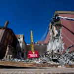 Crews work on the demolition of the YMCA in downtown Everett on Tuesday. (Olivia Vanni / The Herald)
