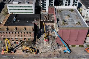 Demolition of the YMCA in downtown continues on Tuesday, April 13, 2021 in Everett, Wa. (Olivia Vanni / The Herald)