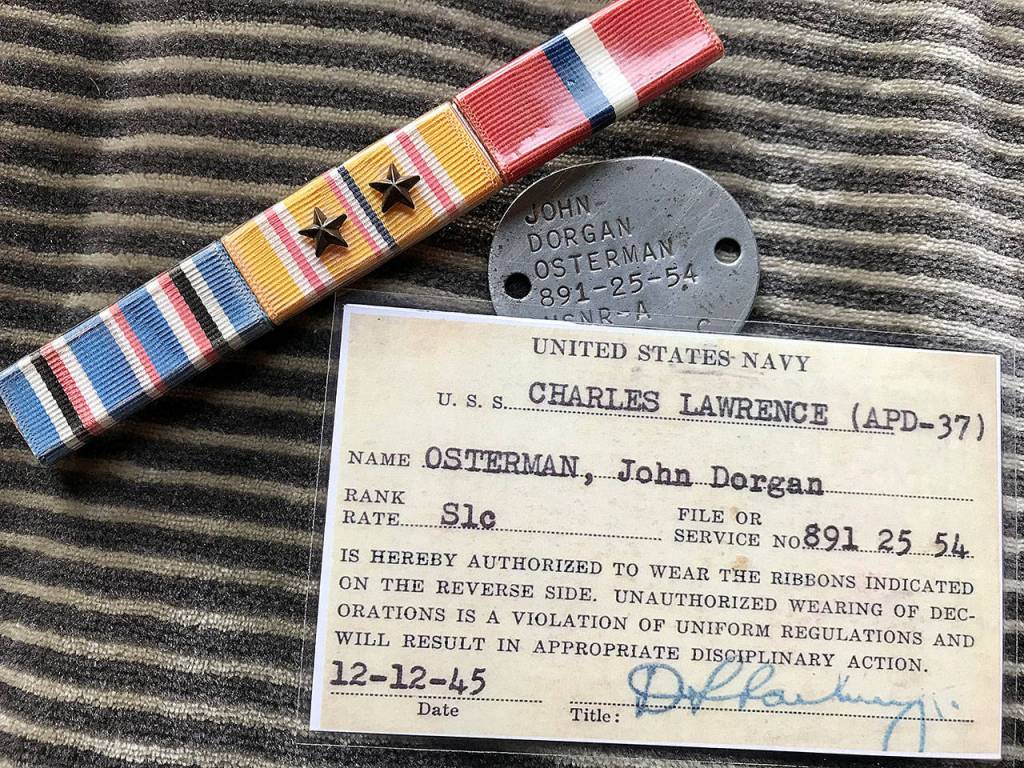 Shown are John D. Ostermans battle stars, dog tag and card authorizing him to wear the stars. (Jeanne-Marie Osterman)