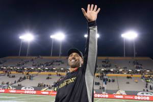 Hamilton Tiger-Cats coach Orlondo Steinauer waves to people in the crowd after the team's Canadian Football League game against the Toronto Argonauts in Hamilton, Ontario, Saturday, Nov. 2, 2019. (Peter Power/The Canadian Press via AP)