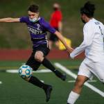 Kamiaks Wyatt Stevens (left) gets past Meadowdale defender Abraham Valle Torres and looks for a shot at goal during a game April 16, 2021, in Mukilteo. (Olivia Vanni / The Herald)