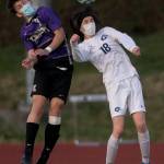 Kamiaks Charlie Soukup (left) and Meadowdales Theo Uherka Hartman jump up to head the ball during a game on April 16, 2021, in Mukilteo. (Olivia Vanni / The Herald)