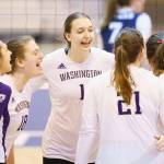 Washingtons Lauren Sanders (center) celebrates with teammates during an NCAA Tournament game against Dayton on April 15, 2021, in Omaha, Neb. (Mark Kuhlmann/NCAA Photos)