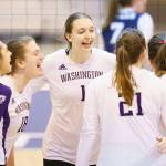 Mark Kuhlmann / NCAA Photos
Washingtons Lauren Sanders (center) celebrates with teammates during an NCAA Tournament game against Dayton on Thursday in Omaha, Neb.