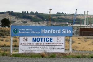 FILE - In this July 9, 2014 file photo, a sign informs visitors of prohibited items on the Hanford Site near Richland, Wash. The U.S. Department of Energy has confirmed that two underground structures at the decommissioned Hanford nuclear reservation in Washington state have been stabilized after they were deemed at risk of collapsing and spreading radioactive contamination into the air. (AP Photo/Ted S. Warren, File)