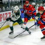 The Silvertips Cole Fonstad (42) races for a rebound with Chiefs Jordan Chudley and Adam Beckman giving chase on March 20 at Angel of the Winds Arena in Everett. (Kevin Clark / Herald file)