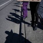 Protestors stand along 80th Street NE in front of the Marysville School District Service Center on Wednesday. (Olivia Vanni / The Herald)