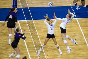 Kentucky's Elise Goetzinger (11) spikes the ball from a set by Madison Lilley (3) against Washington during a semifinal in the NCAA women's volleyball championships Thursday, April 22, 2021, in Omaha, Neb. (AP Photo/John Peterson)