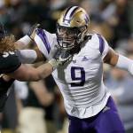 Colorado tight end Brady Russell (38) and Washington linebacker Joe Tryon (9) in the second half of an NCAA college football game Saturday, Nov. 23, 2019, in Boulder, Colo. Colorado won 20-14. (AP Photo/David Zalubowski)