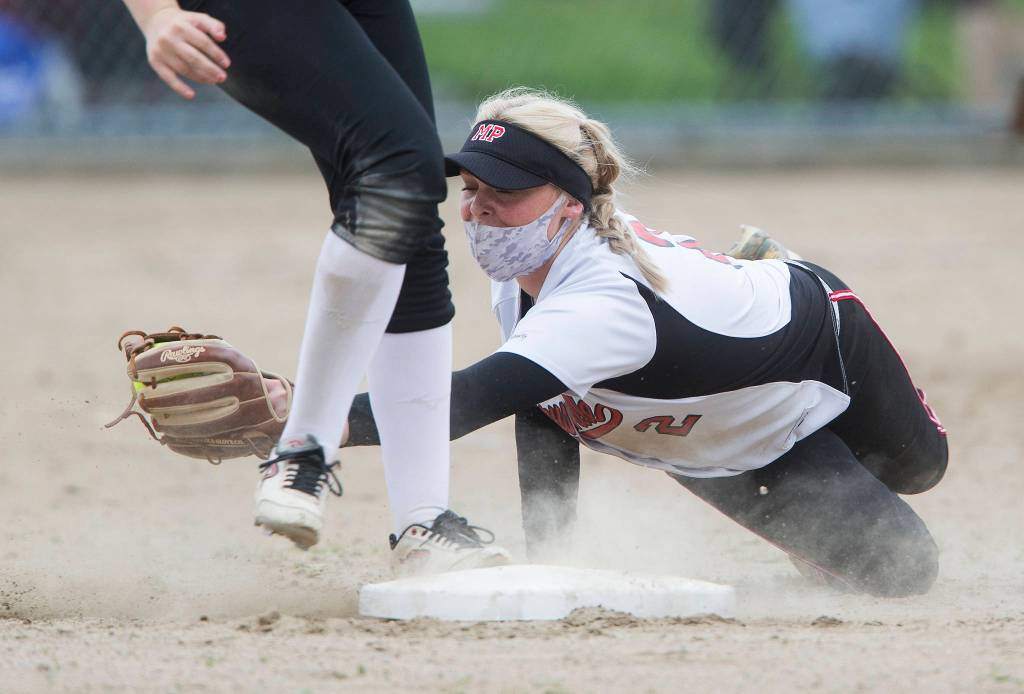 Marysville Pilchucks Cassidy Phelps misses the tag on Jacksons Hailey Pelletier during a game on April 28, 2021, in Mill Creek. Jackson beat Marysville Pilchuck 6-0. (Andy Bronson / The Herald)