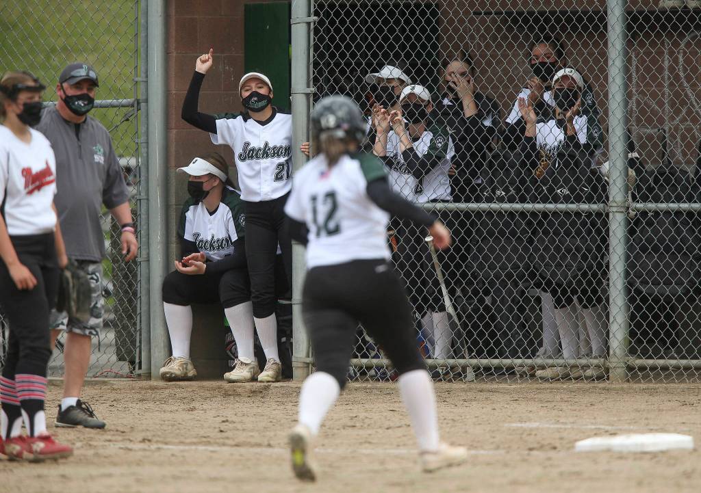 Jackson players celebrate a solo home run by Kalia Zellmer during a game against Marysville Pilchuck on April 28, 2021, in Mill Creek. Jackson beat Marysville Pilchuck 6-0. (Andy Bronson / The Herald)