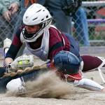 Lakewoods Ashtyn Falor (top) tags out Kamiaks Jayden Bushnell during a game Friday afternoon at Kamiak High School in Mukilteo. The Knights won 2-0. (Kevin Clark / The Herald)
