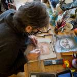 Snohomish artist Cathy Tanasse works on facial proportions on one of her Memory Project portraits, March 19 in Snohomish. (Olivia Vanni / The Herald)