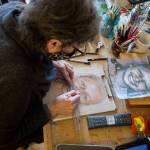 Snohomish artist Cathy Tanasse works on facial proportions on one of her "Memory Project" portraits on Friday, March 19, 2021 in Snohomish, Wa. (Olivia Vanni / The Herald)