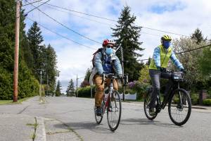 Herald Street Smarts columnist Ben Watanabe and Edmonds City Councilman Luke Distelhorst tour planned new bike lanes on Bowdoin Way on Tuesday morning in Edmonds. (Kevin Clark / The Herald)