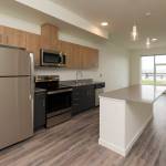 The windows in the kitchen and living room offer views of the water in the Waterfront Place Apartments in Everett. (Andy Bronson / The Herald)
