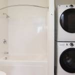 A stacked washer and dryer set is seen in one of 135 apartments available in the Waterfront Place Apartments in Everett. (Andy Bronson / The Herald)