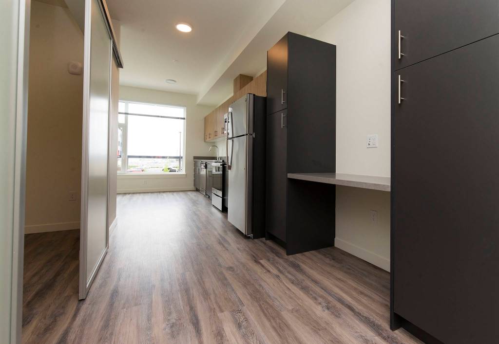One of the many single-bedroom designs, this one with a desk area, is seen in the Waterfront Place Apartments in Everett. (Andy Bronson / The Herald)