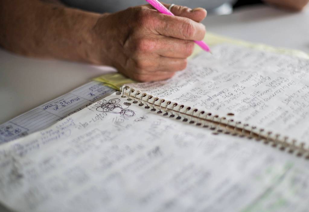 Rachael Kendricks notebook is filled with names and phone numbers of places where shes applied for jobs. (Olivia Vanni / The Herald)