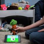 David Stowells animated YouTube series plays while he shows off some of his characters. (Olivia Vanni / The Herald)