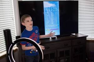 David Stowell, 10, runs through his daily local weather report from his home on Wednesday, April 28, 2021 in Lake Stevens, Wash. (Olivia Vanni / The Herald)