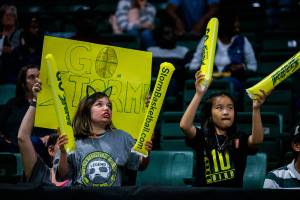 Seattle Storm fans cheer during the game against the Los Angeles Sparks at Angel of the Winds Arena on Friday, June 21, 2019 in Everett, Wash. (Olivia Vanni / The Herald)