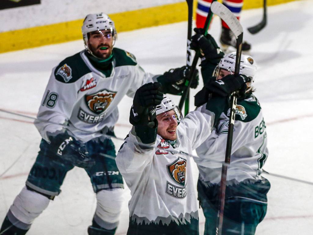 The Silvertips Ethan Regnier (bottom) celebrates a goal against the Chiefs during a game on May 7, 2021, at Angel of the Winds Arena in Everett. (Kevin Clark / The Herald)