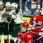 Silvertips' Cole Fonstad (left -right) Jackson Berezowski and Ethan Regnier celebrate Berezowski's goal in the second period against Chiefs' Mac Gross (6) and Mason Beaupit (30) during the final home game Friday night at Angel of the Winds Arena in Everett on May 7, 2021.  (Kevin Clark / The Herald)