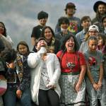 Linda Desautel, center in white, looks skyward and cheers with friends and Colville Confederated Tribe members as they rally in support of her husband Rick Desautel, whose case in the Canadian Supreme court arguing for the Sinixt peoples right to hunt traditional lands in Canada was first heard. (Tyler Tjomsland/The Spokesman-Review via AP)