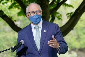 Gov. Jay Inslee signed House Bill 1386 on Monday. Here, he talks in Tukwila before last week's signing of the new capital gains tax bill. (AP Photo/Ted S. Warren, file)