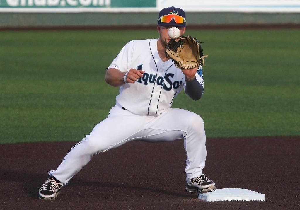 Aquasoxs Kaden Polcovich keeps an eye on the ball and makes a double play as the Everett Aquasox beat the Tri-City Dust Devils in a home opening game at Funko Field on Tuesday, May 11, 2021 in Everett, Washington. (Andy Bronson / The Herald)