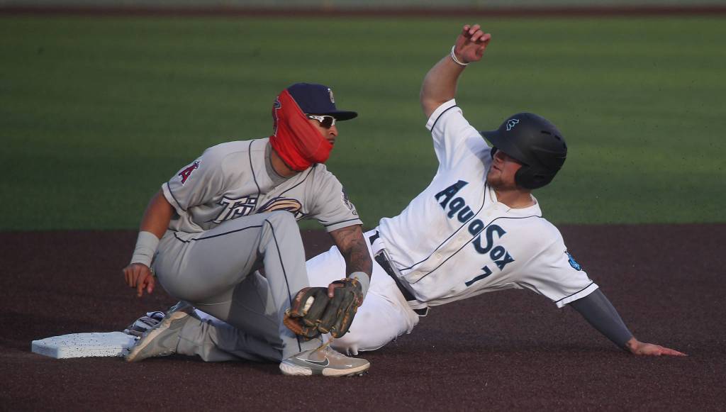 The AquaSoxs Kaden Polcovich beats the tag at second base during a game against the Dust Devils on May 11, 2021, at Funko Field in Everett. (Andy Bronson / The Herald)