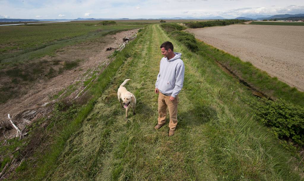 Tyler Breum and his dog Charlie. (Andy Bronson / The Herald)