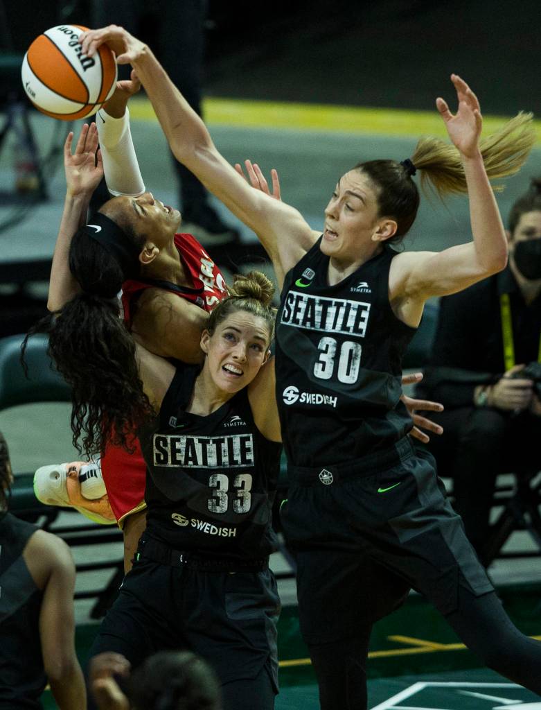 Seattle Storms Breanna Stewart and Katie Lou Samuelson fight for a rebound during a game agains the Las Vegas Aces on May 15, 2021, in Everett. (Olivia Vanni / The Herald)